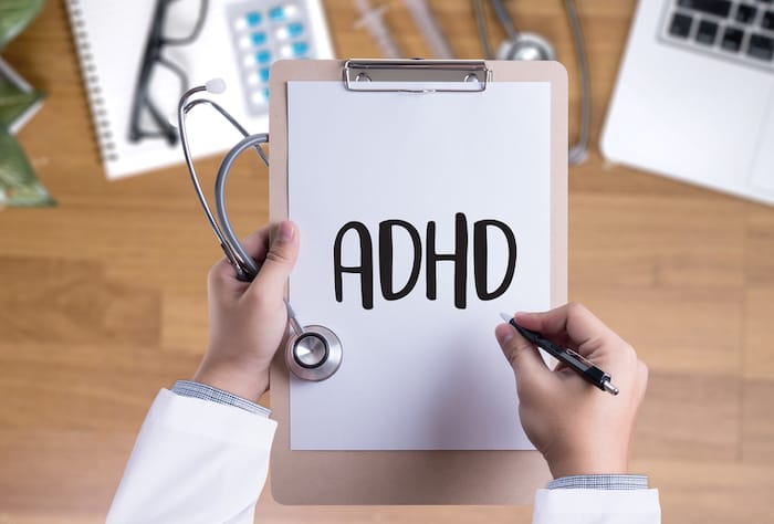 adhd written on clipboard