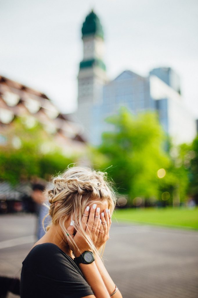 Lady sitting on bench dealing with microaggressions