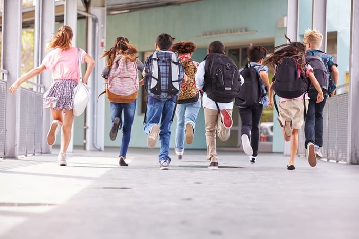 Kids running to Class