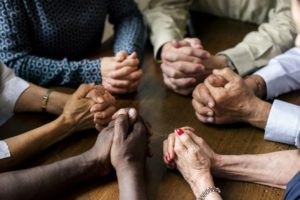 Group Holding Hands Together