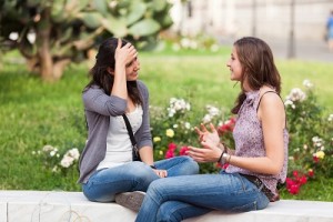 Two Young Women on a Bench at Park