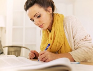 Studious Woman Writing Something