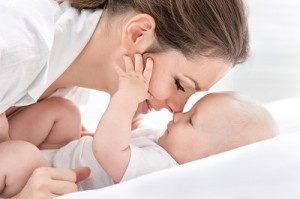 Portrait of happy mother and baby who overcame Postpartum Depression in Women