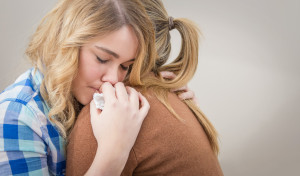 Mother and daughter hugging after discussing eating disorders