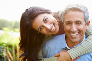 Portrait Of Loving Hispanic Couple In Countryside