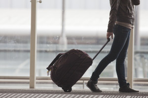 Woman carries your luggage at the airport terminal