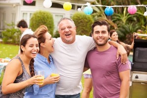 Parent With Adult Children Enjoying Party In Garden