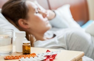 Sick woman sleeping in bedroom