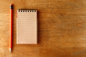 Pencil and a notebook on a table