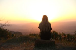 Woman enjoying sunrise