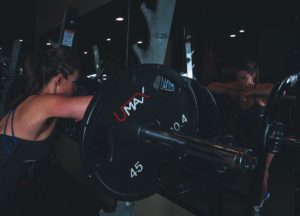 Woman lifting weights and exercising