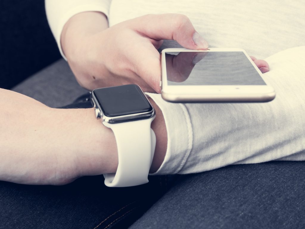 Woman checking her phone's browser for dysfunctional eating behaviors