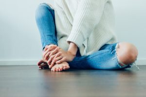 Woman in torn jeans with Weight Obsessed Culture