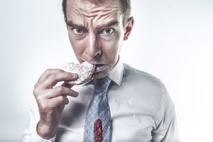 Man Eating a Dohnut