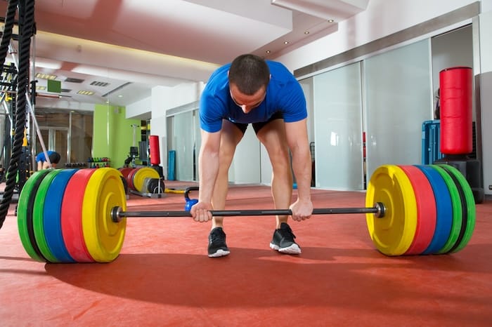 man power lifting bar with weights