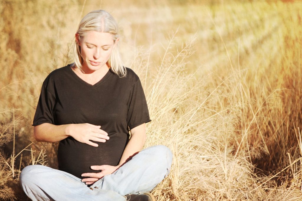 Woman Struggling With Pregorexia In A Wheat Field