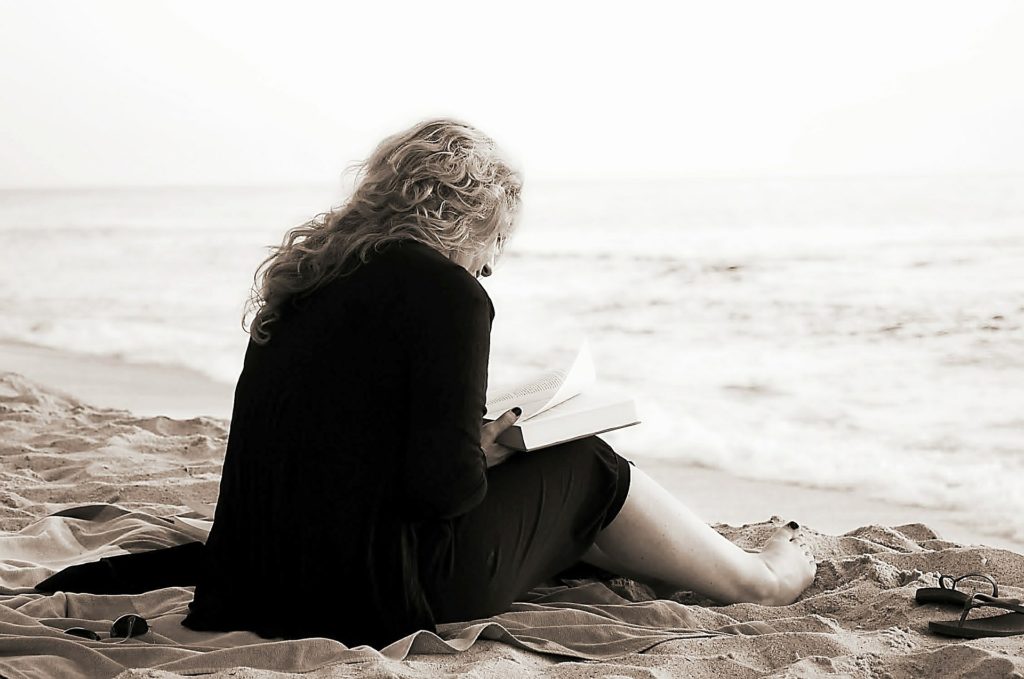 Lady sitting on a beach