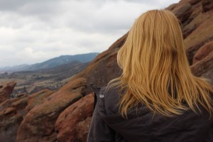 Girl on mountain thinking about recovery from co-occurring disorders