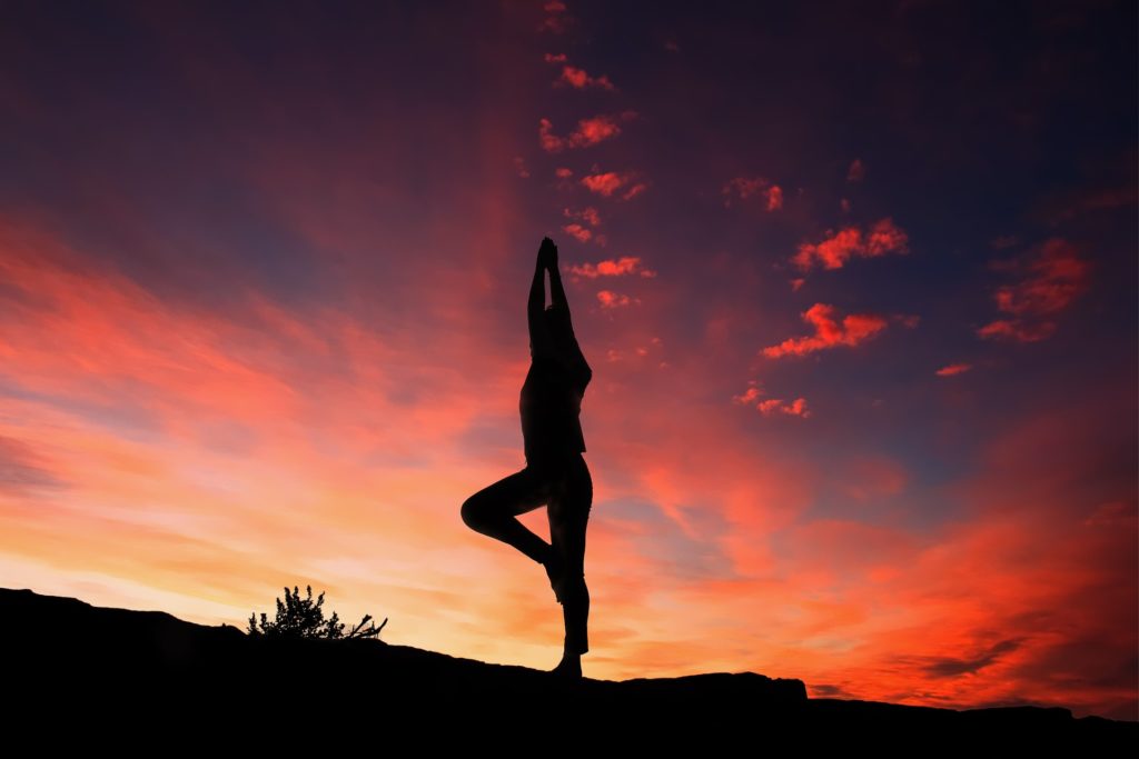 Woman in the sunset enjoying exercise