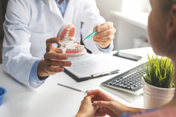 dentist talking to patient