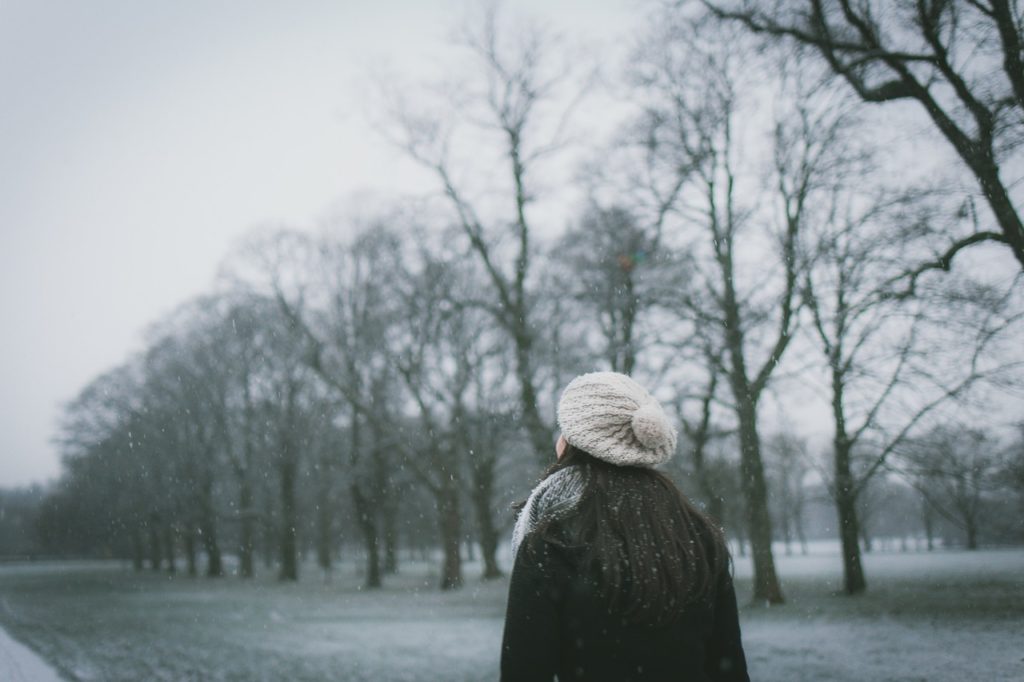 Woman in snow considering Intuitive Eating