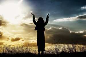 Woman worshipping and enjoying her religion