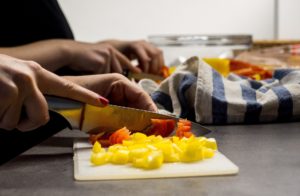 healthy coping skills by a Woman mindfully cutting vegetables 