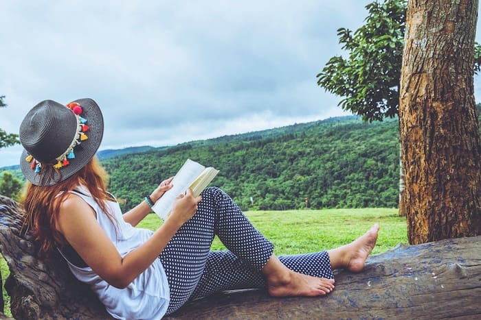 woman reading in nature